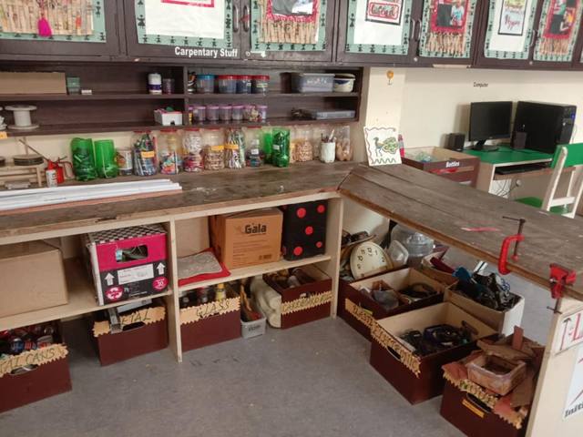 A larger corner with materials stored in labelled boxes