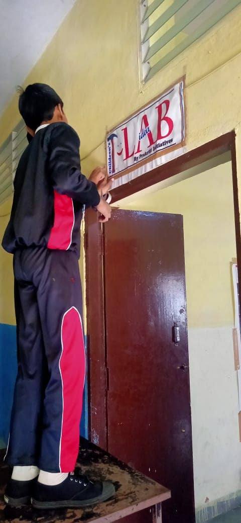 A child at the T-LAB door in school